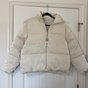 a new day Women’s Short Iridescent Puffer Jacket. Color: Ivory. Size: S. NWT